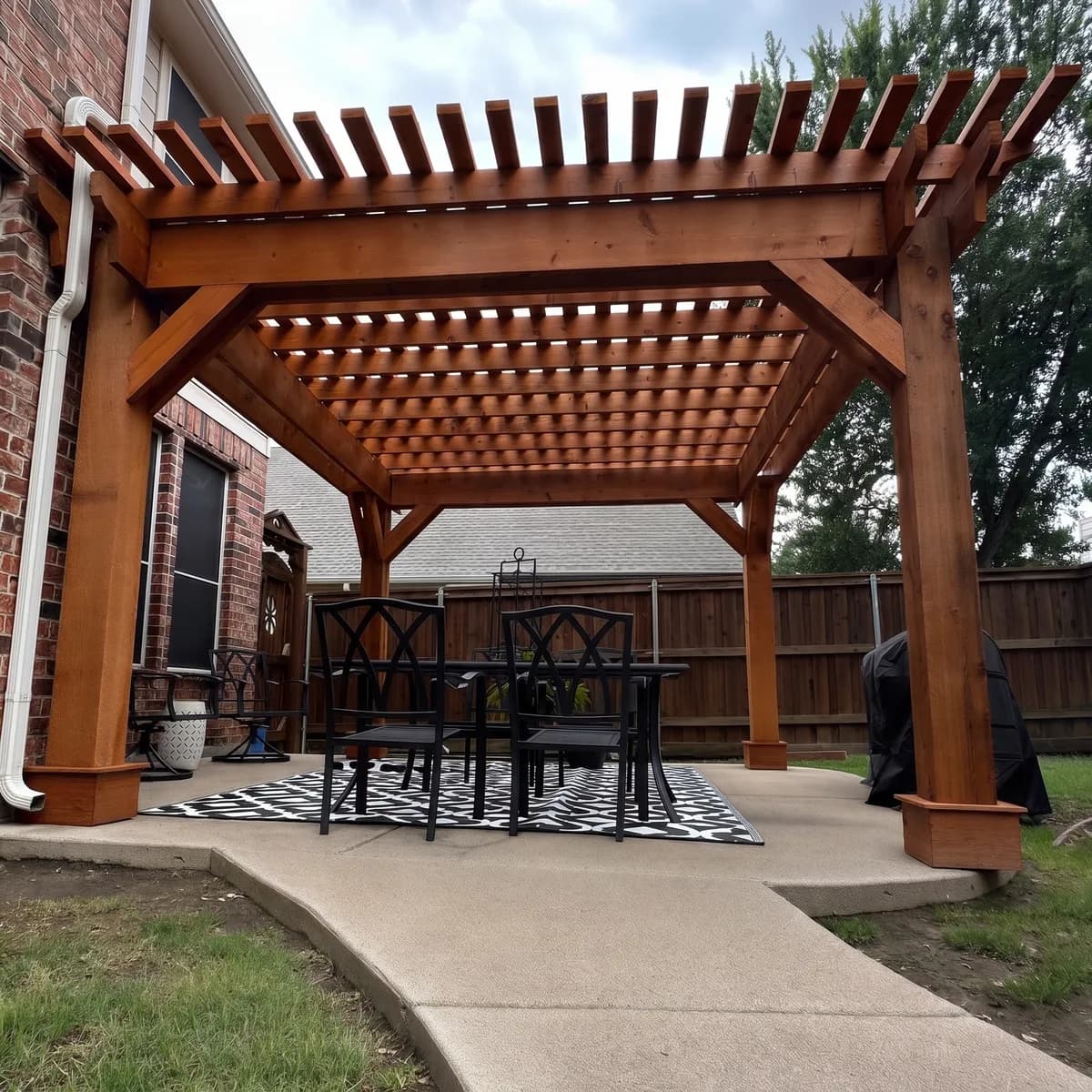 A Royal Patio cedar pergola framing an outdoor dining table
